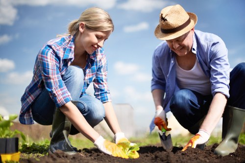 Workers applying safe landscaping practices on a managed outdoor site